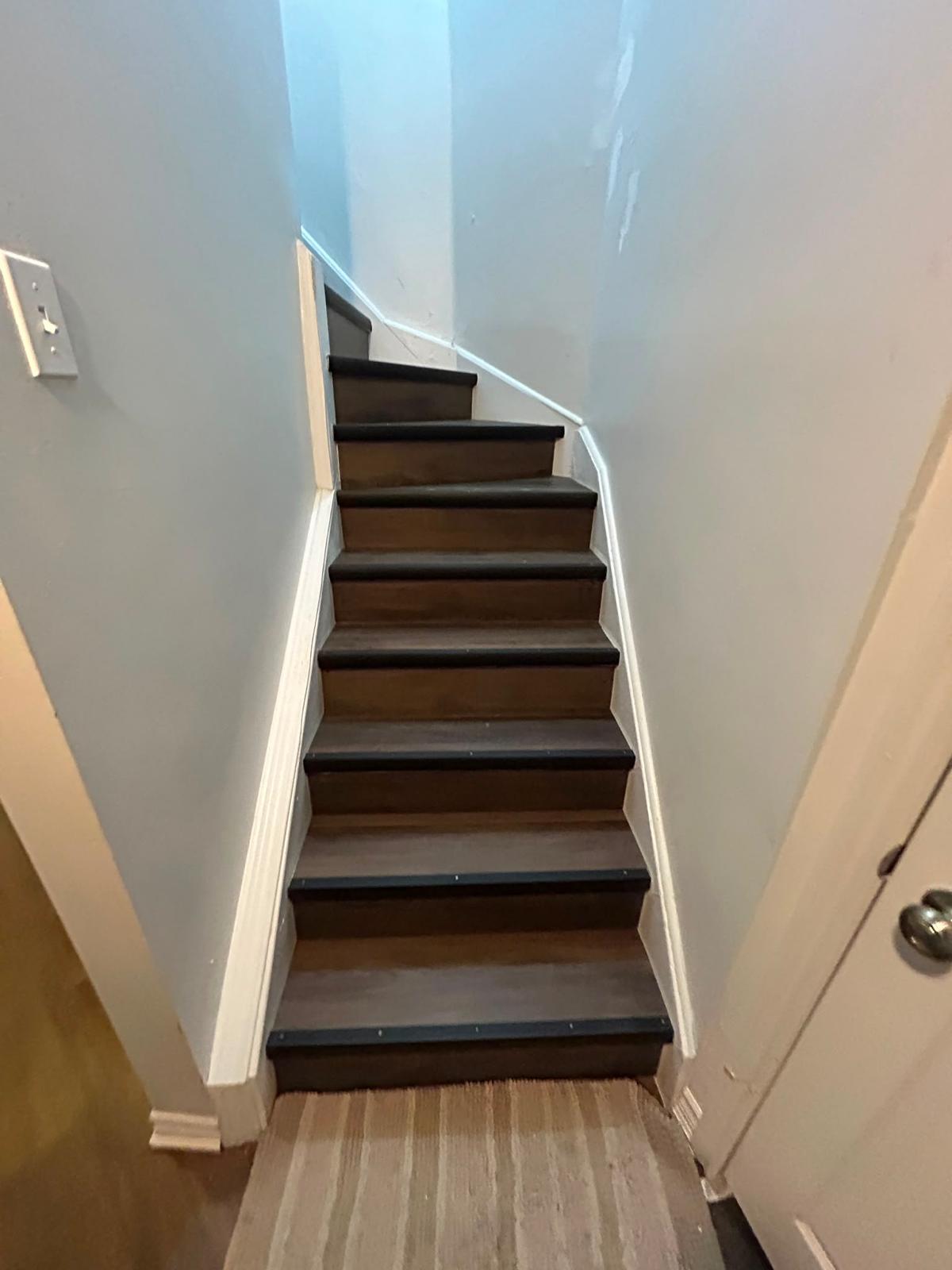 Renovated staircase with dark treads